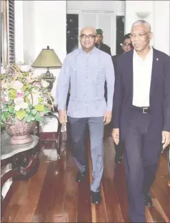  ?? (Ministry of the Presidency photo) ?? President David Granger escorts Leader of the Opposition, Mr. Bharrat Jagdeo to the Conference room for their meeting this evening.