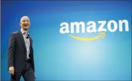  ?? AP PHOTO/TED S. WARREN, FILE ?? In this June 16, 2014, file photo, Amazon CEO Jeff Bezos walks onstage for the launch of the new Amazon Fire Phone, in Seattle. Pennsylvan­ia politician­s want the online shopping giant to put its second headquarte­rs in the state.