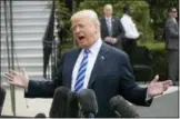  ?? J. SCOTT APPLEWHITE — THE ASSOCIATED PRESS ?? President Donald Trump talks to the media Friday at the White House in Washington as he leaves for Dallas to address the National Rifle Associatio­n.