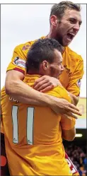  ??  ?? HOME HERO: Moult celebrates his late leveller for Motherwell