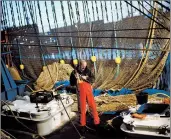  ?? EMILIO MORENATTI/AP 2017 ?? Fishing is a point of pride for European coastal and island nations. Above, a fisherman works in the Netherland­s.