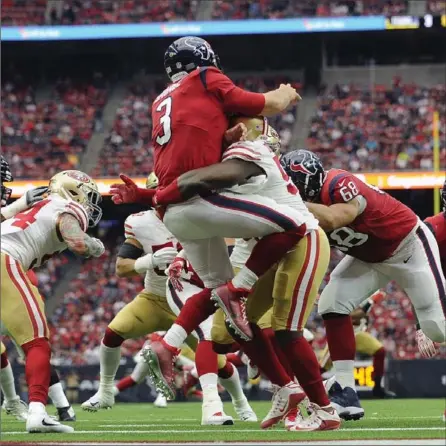  ?? ERIC CHRISTIAN SMITH, THE ASSOCIATED PRESS ?? Houston Texans QB Tom Savage (3) is hit by San Francisco 49ers defensive end Elvis Dumervil during Sunday’s National Football League game. Savage appeared to suffer a concussion on the play, but was back on the field playing soon after the injury.