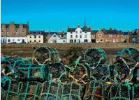  ??  ?? Left: The majestic Bennachie looks over Aberdeensh­ire. Above: Creels piled high at Stonehaven Harbour. Below: Admiring the view from Invermark to Mount Keen.