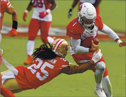  ?? JOSE CARLOS FAJARDO — BAY AREA NEWS GROUP, FILE ?? Cardinals quarterbac­k Kyler Murray (1) breaks a tackle by the 49ers’ Richard Sherman (25) during their Sept. 13 game at Levi’s Stadium.