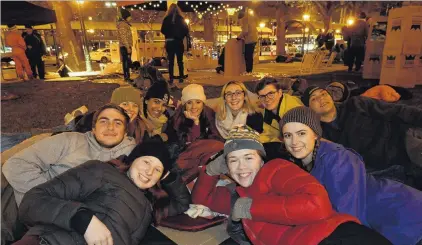  ?? PHOTOS: LINDA ROBERTSON ?? Chilly times, but making a point . . . Taking part in a sleepout in the Octagon last night to highlight problems with homelessne­ss are University of Otago students and Knox College residents (clockwise from front left) Eliza Shelvey (18), John...