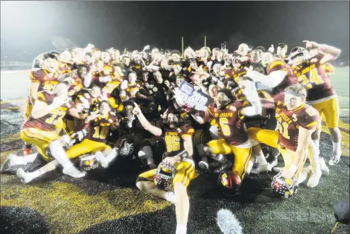  ?? Matthew Brown / Hearst Connecticu­t Media ?? St. Joseph celebrates a 1713 win over Hand in the CIAC Class L state championsh­ip football game on Saturday at Veterans Memorial Stadium in New Britian.