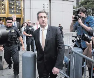  ?? Craig Ruttle ?? The Associated Press Michael Cohen, former personal lawyer to President Donald Trump, leaves federal court after reaching a plea agreement Tuesday in New York.