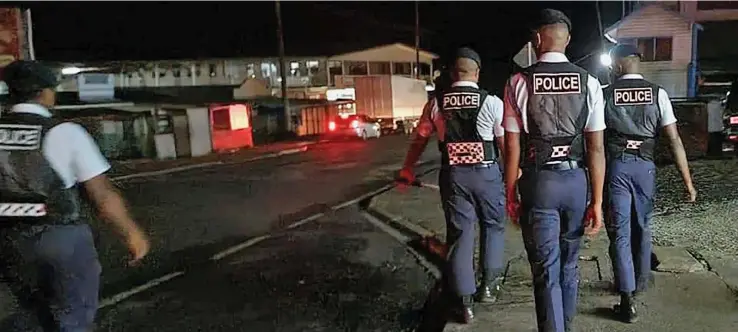  ?? Fiji Police officers patrolling the streets. ??