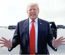  ?? CAROLYN KASTER/AP ?? President Donald Trump speaks to reporters briefly about the special counsel’s report before boarding Air Force One on Sunday in West Palm Beach, Fla., on his way back to Washington.