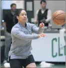  ?? CHARLES KRUPA — ASSOCIATED PRESS FILE ?? Celtics assistant coach Kara Lawson passes the ball at the team’s training facility in Boston last July.