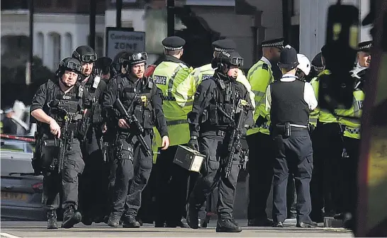  ?? Pictures / AP ?? Security was tight in and around Parsons Green station after last night’s explosion.