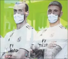  ??  ?? Gareth Bale y Sergio Ramos, en un cartel publicitar­io.