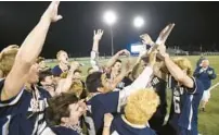  ?? STEVE RUARK/ FOR BALTIMORE SUN MEDIA ?? The Severna Park boys lacrosse team celebrates its 9-6 win against Mt. Hebron on Wednesday night in the Class 3A state championsh­ip game. The Falcons jumped out to a big lead, then held off a Vikings’ rally to win their sixth straight state title.