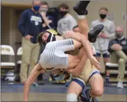  ?? AUSTIN HERTZOG - MEDIANEWS GROUP ?? Spring-Ford’s Quinn Smith takes down Henderson’s Max Jackman during his match-clinching win at 126 pounds during the District 1-3A Duals championsh­ip Saturday.