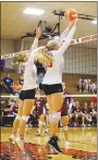  ?? Westside Eagle Observer file photo/RANDY MOLL ?? Gravette’s Drew Madison and Piper Batie go up to block a Gentry kill attempt.