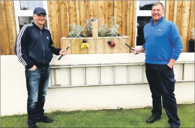  ??  ?? George wins Spring Meeting scratch
Dunaverty Golf Club’s acting captain Raymond Harvey, right, presents George MacMillan with the scratch prize of a bottle of Jura whisky.