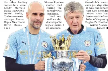  ?? AFP ?? Manchester City’s manager Pep Guardiola (left) holds the Premier League trophy on May 23.