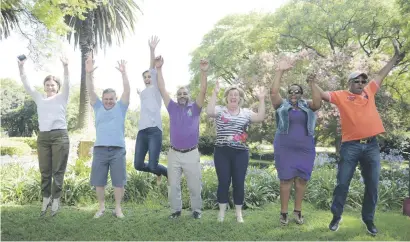  ?? Picture: Tracy Lee Stark ?? Parents jump for joy after collecting matric results with their daughters from St Andrews College yesterday.