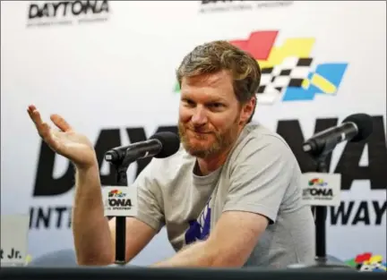  ?? WILFREDO LEE — THE ASSOCIATED PRESS FILE ?? In this file photo, Dale Earnhardt Jr. gestures as he speaks during a news conference at Daytona Internatio­nal Speedway, in Daytona Beach, Fla. Below, Kurt Busch drives the Monster Energy No. 41 car last season at Dover. NASCAR has a new sponsor, a new...