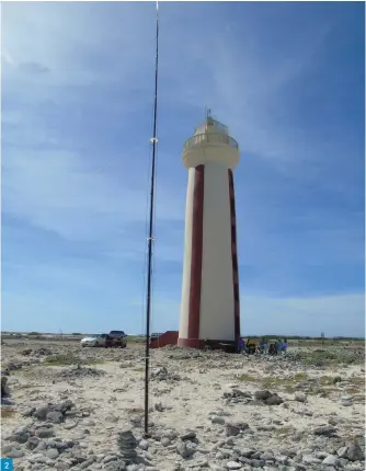  ??  ?? Fig. 1: IOTA Contest certificat­e received by PJ4DX for highest-scoring station from South America. Fig. 2: DX Commander vertical at the Willemstor­en Lighthouse, BQ0002, during the ILLW. Fig. 3: Operating ILLW: Peter PJ4NX on the mic with SWL Ish giving him the thumbs up. In the background Bert PJ4KY, Rinse PJ4RF and Gerard PJ4GR. Fig. 4: The Europa Point Lighthouse, Gibraltar, from where ZB2LGT was active. Fig. 5: John ZB2JK operating from the great siege tunnels viewing platform in Gibraltar. Fig. 6: 1995 QSL from Betty Christian VR6YL. Fig. 7: G3JNB/P escaped lockdown with his FT-818, ‘Miracle Whip’, straight key – and a thermos. 2