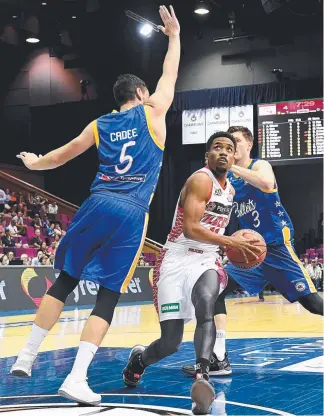  ?? Picture: GETTY IMAGES ?? Bryce Cotton takes on the Bullets in Brisbane last month.