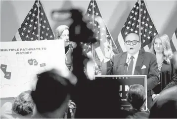  ?? ERIN SCHAFF/THE NEW YORK TIMES 2020 ?? Rudy Giuliani, a lawyer for then-President Donald Trump, speaks during a news conference about the results of the presidenti­al election. Giuliani is being sued by Dominion Voting Systems in a defamation lawsuit.