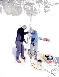  ?? — AFP photo ?? Scientists working at the Cerro Bologna glacier in the metropolit­an region of Santiago.