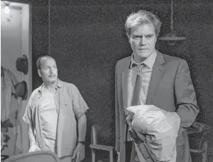  ??  ?? Vinnie (Guy Van Swearingen) and Carter (Michael Shannon) deal with their unresolved issues in A Red Orchid Theatre’s staging of “Simpatico.”