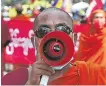  ??  ?? A monk chants slogans at a protest in Mandalay yesterday