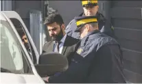  ?? LIAM RICHARDS ?? Jaskirat Singh Sidhu, the driver of a transport truck involved in the deadly crash with the Humboldt Bronco’s bus, is taken into custody after being sentenced to eight years in prison.