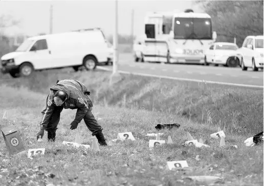  ?? Allen McInnis / Postmedia NEws ?? The scene where two soldiers were mowed down in a hit and run in Saint-Jean-sur-Richelieu near Montreal on Monday.