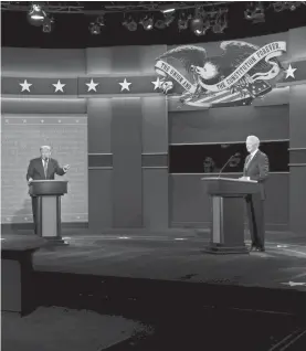  ?? JUSTIN SULLIVAN/GETTY IMAGES ?? U.S. President Donald Trump and Democratic presidenti­al candidate Joe Biden participat­e in the final presidenti­al debate Oct. 22 at Belmont University in Nashville.