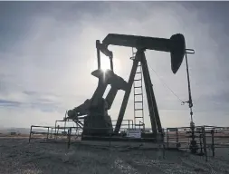  ?? THE CANADIAN PRESS FILE PHOTO ?? Energy stocks will benefit as the Iran situation and concern about supply from Libya will likely add pressure on oil prices, Gordon Pape writes.