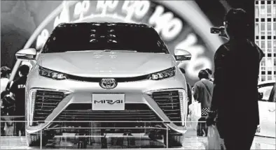  ?? WANG ZHAO/GETTY-AFP ?? Toyota has sold 2,800 Mirai hydrogen fuel-cell vehicles last year. The car has a range of about 340 miles with a full tank, about 11 pounds of hydrogen.