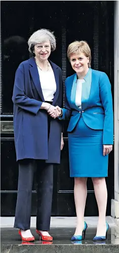  ??  ?? Home truths: Theresa May (left) and Nicola Sturgeon at Bute House in Edinburgh