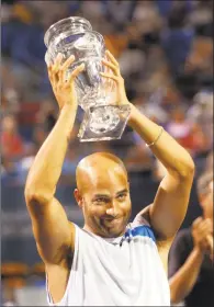  ?? Hearst Connecticu­t Media file photo ?? James Blake holds his trophy at the Pilot Pen in 2007.