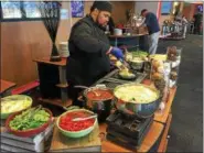  ?? DAVID S. GLASIER — THE NEWS-HERALD ?? Sauteed pasta station in the Infiniti Club at Progressiv­e Field.