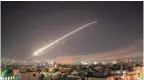  ??  ?? Missile fire lit up the sky over Damascus, Syria, April 14 as the U.S. and allies launched an attack.