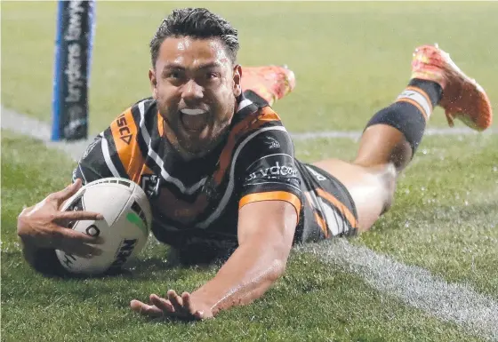  ?? Photo: Cameron Spencer/Getty Images ?? TRY MACHINE: David Nofoaluma of the Wests Tigers could move to a rival club in 2022.