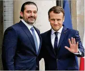  ?? CHRISTOPHE ENA / AP ?? French President Emmanuel Macron (right) greets Lebanese Prime Minister Saad Hariri upon his arrival at the Elysee Palace in Paris on Saturday. Hariri may be back in Beirut next week, seeking to dispel fears that he had been held against his will in...