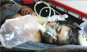  ?? MOHAMED AL-BAKOUR/AFP ?? A Syrian child receives treatment at a hospital in the town of Maaret al-Noman after a suspected gas attack in Khan Sheikhun, a rebel-held town in Syria’s northweste­rn Idlib province, yesterday.