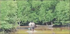  ??  ?? ■ In the clusters of small islands interconne­cted by streams and creeks, residents fishing for dinner or a living, tourists out for a swim, could come face to face with a croc.