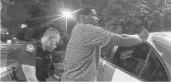  ?? ATLANTA POLICE DEPARTMENT/HANDOUT VIA REUTERS ?? Former Atlanta Police Department officer Garrett Rolfe searches 27-year-old Rayshard Brooks in a Wendy’s restaurant parking lot in a still image from the video body camera of officer Devin Bronsan in Atlanta, Georgia, U.S. June 12, 2020. Video taken June 12, 2020.