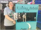  ?? Matt Fernandez/The Signal ?? Bianca Fonseca set up a kissing booth at her BowWows & Meows Pet Fair stall — with her Boston terriers Charlie and Peanut — to collect donations for the Kittens of LA rescue.