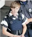  ?? CHUCK BURTON/THE ASSOCIATED PRESS ?? Charleston, S.C., shooting suspect Dylann Roof is escorted from a courthouse in Shelby, N.C., Thursday.