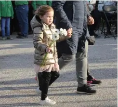  ??  ?? Top right: Five-year-old Kiki Niewenhuij­se carries flowers in October 2019 to lay at the Canadian Memorial Sloedam near the city of Arnemuiden, Netherland­s.