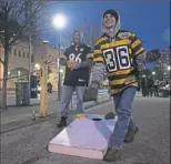  ?? Steph Chambers/Post-Gazette ?? Mark Vogel of Enon Valley and Tim Dubec of Richmond, Va., play cornhole.