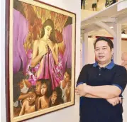  ??  ?? Antique artist Alberto Emmanuel Villavert III with his “Babae, Masdan Mo Ang Iyong Mga Anak” masterpiec­e