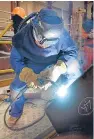  ??  ?? A welder tackles some steel at BiFab in Fife.