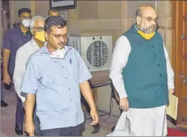  ?? PTI ?? Union home minister Amit Shah (R) and Delhi CM Arvind Kejriwal in New Delhi on Sunday.